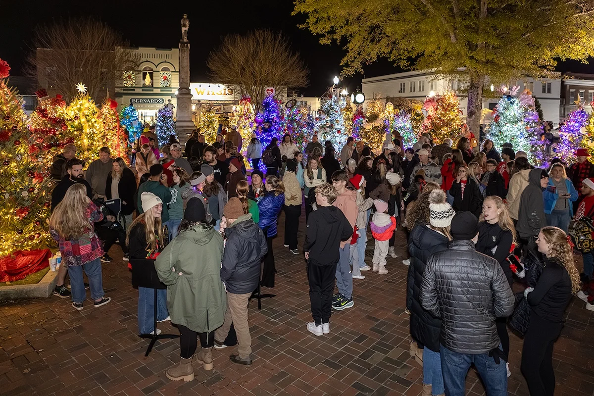 Visitors gather among decorated Christmas trees in Downtown Jasper.