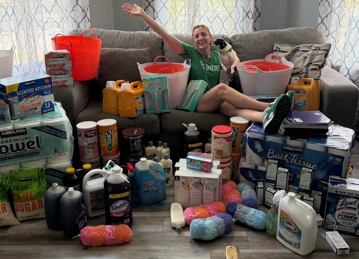 Hope for Women's founder sits among donated household supplies.